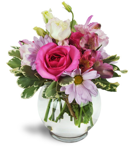 Fondly Fuchsia™. An arrangement by Avenue Flowers and Gifts. Roses, daisies, lisianthus, and more are beautifully arranged in a clear bubble bowl..