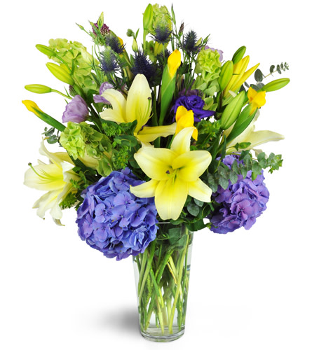 Elegant Wishes™. An arrangement by Avenue Flowers and Gifts. Wow them with lilies and hydrangea elegantly arranged with iris, Bells of Ireland,...