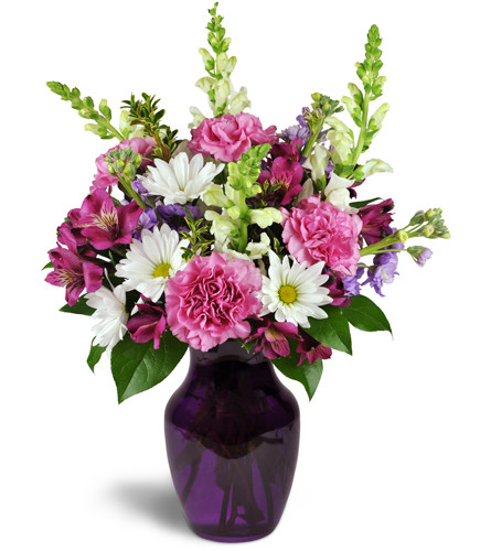 Lavender Daydreams™. An arrangement by Avenue Flowers and Gifts. Featuring lavender carnations and alstroemeria arranged with white daisies,...