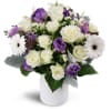 Oasis in Bloom™ - Premium. An arrangement by Avenue Flowers and Gifts. Featuring white spray roses, purple tulips, and more..