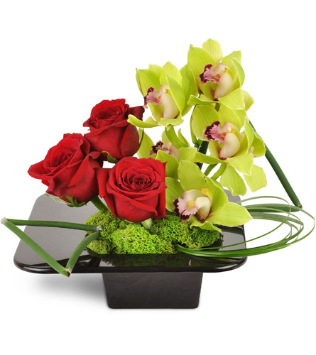 Graceful Sanctuary Bouquet™. An arrangement by Avenue Flowers and Gifts. Three red roses and an extravagant stem of green Cymbidium orchids are...