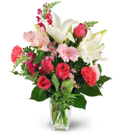 Love Blooms. An arrangement by Avenue Flowers and Gifts.