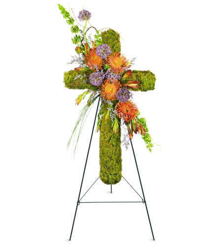 Natural Beauty Sympathy Cross™ - Deluxe. An arrangement by Avenue Flowers and Gifts. A moss-covered cross is enhanced with pincushion protea and...