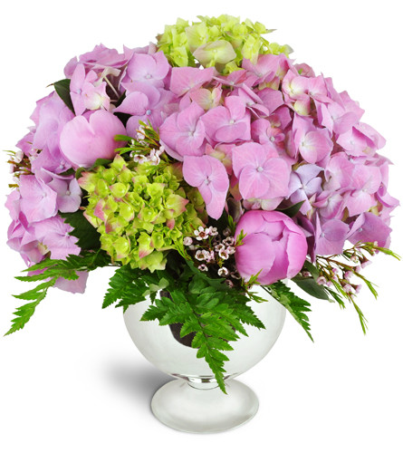 Classic Grace™. An arrangement by Avenue Flowers and Gifts. Pink and green hydrangeas and pink peonies are beautifully arranged in a shapely vase..