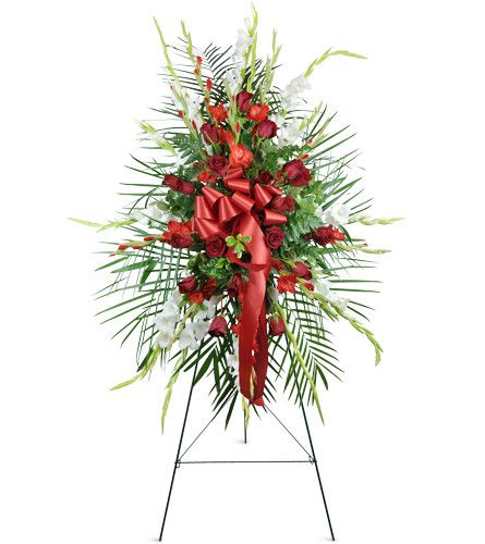 Love Forever Tribute. An arrangement by Avenue Flowers and Gifts. Over a dozen classic red roses are arranged with red and white gladiolus..