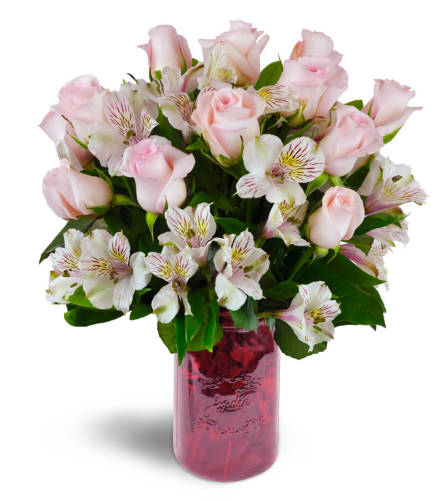 Blushing Love Bouquet™ - Deluxe. An arrangement by Avenue Flowers and Gifts. Gorgeous pink roses and Peruvian lilies are delicately arranged into...