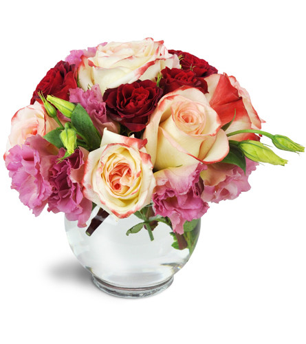 Sweet Smile™. An arrangement by Avenue Flowers and Gifts. Treat them to gorgeous roses, spray roses, and lisianthus arranged in a petite bowl..