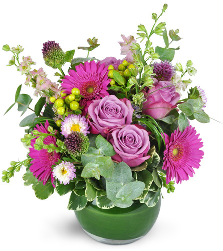 Parisian Garden. An arrangement by Avenue Flowers and Gifts. A gorgeous mix of larkspur, gerbera daisies, lavender roses, garden roses, and...