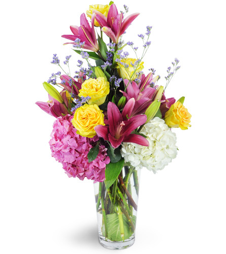 Spring All Year™. An arrangement by Avenue Flowers and Gifts. Treat them to hydrangea, lilies, Finesse roses, and more arranged in a glass vase..