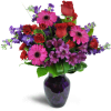 Romance Medley™ - Premium. An arrangement by Avenue Flowers and Gifts. Purple Peruvian lilies are arranged with stunning red spray roses and...