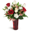 Romance of Roses™ - Standard. An arrangement by Avenue Flowers and Gifts. Give a stunning gift of red and cream roses arranged with carnations,...