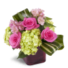 Peek of Chic™ - Standard. An arrangement by Avenue Flowers and Gifts. Hot-pink roses, green hydrangea, and pink Peruvian lilies are accented with...