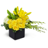 Sensational Smiles™ - Deluxe. An arrangement by Avenue Flowers and Gifts. Yellow roses, Dendrobium orchids, and more are arranged in a ceramic...