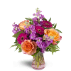 Invigorate™ - Standard. An arrangement by Avenue Flowers and Gifts. This eye-catching arrangement includes roses, mini Gerbera daisies, and more..