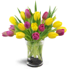 Springtime Duet™ - Deluxe. An arrangement by Avenue Flowers and Gifts. Twenty yellow and violet tulips are delightfully arranged in a glass vase..