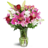 Blushing Heart Bouquet™ - Standard. An arrangement by Avenue Flowers and Gifts. Deep red roses, lush lilies, and pretty pink Gerbera daisies are...