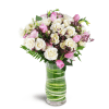 Sweetest Valentine™ - Standard. An arrangement by Avenue Flowers and Gifts. Roses and spray roses are arranged with tulips, lisianthus, and more...