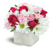 Vibrant Blooms™ - Deluxe. An arrangement by Avenue Flowers and Gifts. Hot pink roses are beautifully arranged with soft pink mini carnations and...