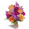 Invigorate™ - Deluxe. An arrangement by Avenue Flowers and Gifts. This eye-catching arrangement includes roses, mini Gerbera daisies, and more..