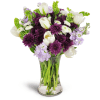 Serene Paradise™ - Standard. An arrangement by Avenue Flowers and Gifts. White tulips, Bells of Ireland, and more are beautifully arranged in a...