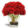 Love's Destiny Bouquet™ - Deluxe. An arrangement by Avenue Flowers and Gifts. Large red rose blooms burst from a clear glass vase lined with river...