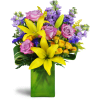 Springtime Kiss™ - Premium. An arrangement by Avenue Flowers and Gifts. Treat them to lavender roses, sunny yellow lilies, purple stock, and more...