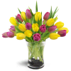 Springtime Duet™ - Premium. An arrangement by Avenue Flowers and Gifts. Twenty yellow and violet tulips are delightfully arranged in a glass vase..