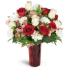 Romance of Roses™ - Premium. An arrangement by Avenue Flowers and Gifts. Give a stunning gift of red and cream roses arranged with carnations,...
